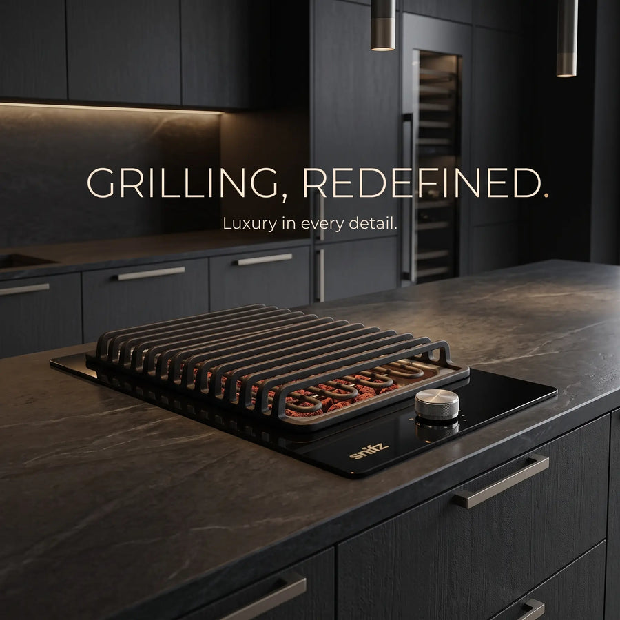 Snifz built-in electric grill with lava rock grate on modern black kitchen island