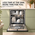 Snifz DW-12 built in dishwasher open and loaded with dishes in a modern green kitchen