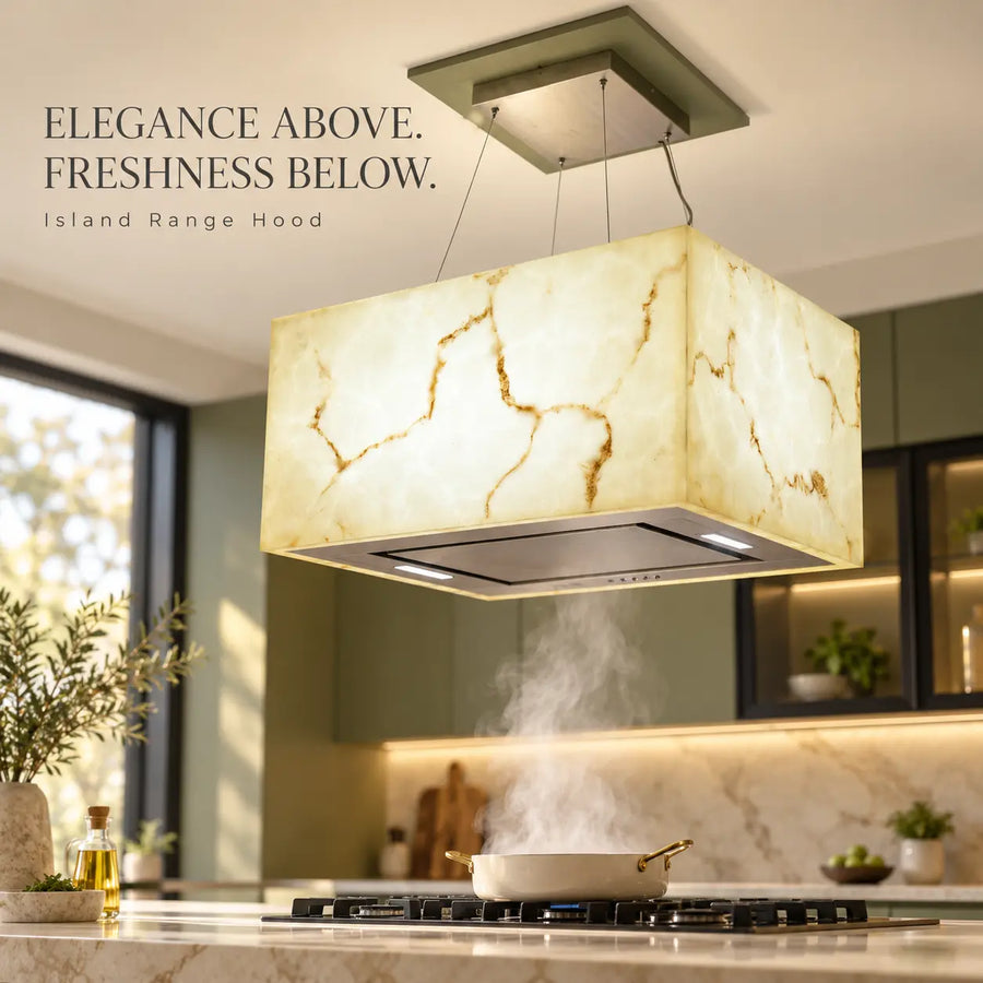 Snifz SZ-Cube 48 white marble island range hood installed above a gas hob in a modern kitchen
