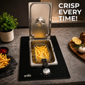 Snifz built-in electric deep fryer frying crispy fries in a modern kitchen countertop